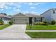 Lovely one-story home with well-kept lawn, attached garage, and inviting front entrance, presenting excellent curb appeal at 3936 Silverstream Ter, Sanford, FL 32771