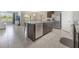 Modern kitchen with an island and breakfast bar, stainless steel appliances and a open layout for entertaining at 3936 Silverstream Ter, Sanford, FL 32771