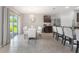 Bright kitchen featuring stainless steel appliances, bar stool seating and sliding door to the backyard at 3936 Silverstream Ter, Sanford, FL 32771