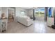 Bright living room with white sofa and large windows at 3936 Silverstream Ter, Sanford, FL 32771