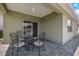 Covered back patio provides a shaded outdoor space for dining and relaxation at 3936 Silverstream Ter, Sanford, FL 32771