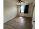 An empty bedroom features wood flooring and a ceiling fan at 4204 Columbia St, Orlando, FL 32811