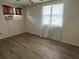 A bedroom features wood flooring, ceiling fan, and a bright window at 4204 Columbia St, Orlando, FL 32811