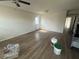 Spacious living room features wood flooring, a back door, and an open entrance to a hallway at 4204 Columbia St, Orlando, FL 32811