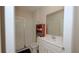 Bright bathroom with a walk-in shower, white vanity, and large mirror for a fresh and modern feel at 4858 Magnetite Loop, Mount Dora, FL 32757