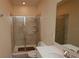 Bathroom featuring a tiled walk-in shower and modern vanity at 4858 Magnetite Loop, Mount Dora, FL 32757