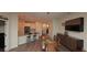 Open-concept dining area with modern table, chairs, and decor leading into the kitchen at 4858 Magnetite Loop, Mount Dora, FL 32757