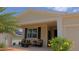 View of covered front porch, complete with comfortable seating, perfect for relaxing at 4858 Magnetite Loop, Mount Dora, FL 32757