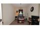 Functional home office space with a computer desk, shelving, and ample lighting at 4858 Magnetite Loop, Mount Dora, FL 32757