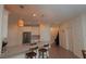Bright kitchen featuring stainless steel appliances, white cabinets, and a spacious breakfast bar at 4858 Magnetite Loop, Mount Dora, FL 32757
