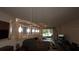Open-concept living room featuring a comfortable sofa and decorative lighting at 4858 Magnetite Loop, Mount Dora, FL 32757