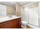 Bathroom featuring single vanity, mirror, a tile shower with glass door, and ceramic tile flooring at 4890 Conway Rd # 66, Orlando, FL 32812