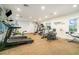 Community gym with treadmills, stationary bikes, weight machines, and mirrors at 4890 Conway Rd # 66, Orlando, FL 32812