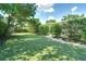 The property offers artificial turf, stone walkways, and lush, mature landscaping at 503 Savona Ct, Altamonte Springs, FL 32701