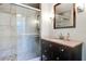 Bathroom featuring glass shower and granite-topped vanity with tiled backsplash at 503 Savona Ct, Altamonte Springs, FL 32701