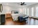 Cozy bedroom with hardwood floors, ceiling fan, and French doors leading to patio at 503 Savona Ct, Altamonte Springs, FL 32701