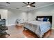 Comfortable bedroom with hardwood floors, ceiling fan, and adjacent desk at 503 Savona Ct, Altamonte Springs, FL 32701