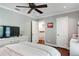 Cozy bedroom with hardwood floors, a ceiling fan, and neutral décor at 503 Savona Ct, Altamonte Springs, FL 32701