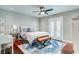 Bedroom featuring hardwood floors, ceiling fan, desk, and french doors at 503 Savona Ct, Altamonte Springs, FL 32701