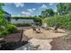 Backyard fire pit area features stone pavers, mulch beds, and comfortable seating at 503 Savona Ct, Altamonte Springs, FL 32701