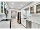 Bright kitchen with stainless steel appliances, white cabinets, and marble countertops at 503 Savona Ct, Altamonte Springs, FL 32701