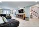 Bright and airy living room featuring built-in shelves, tile floors and modern decor at 503 Savona Ct, Altamonte Springs, FL 32701