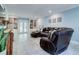 Cozy living room featuring built-in shelving, recessed lighting, and a comfortable leather sectional at 503 Savona Ct, Altamonte Springs, FL 32701