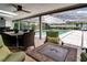Inviting outdoor space with pool view, seating, and a fire pit, perfect for relaxation at 503 Savona Ct, Altamonte Springs, FL 32701