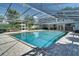 A screened-in pool features an expansive patio, exterior seating, and an outdoor kitchen area at 503 Savona Ct, Altamonte Springs, FL 32701