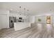 Stylish kitchen featuring stainless steel appliances, a kitchen island, and white cabinetry at 6421 Sw 151St Loop, Ocala, FL 34473