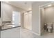 Bathroom features double sink vanity with granite counters and separate toilet room at 6808 Cranes Roost Rd, Harmony, FL 34773