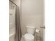 Cozy bathroom with a shower-tub combination and a toilet with a neutral color scheme at 6808 Cranes Roost Rd, Harmony, FL 34773