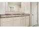 Bathroom vanity featuring double sinks, granite counters, and white cabinets at 6808 Cranes Roost Rd, Harmony, FL 34773