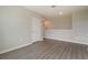 A stylish room with gray floors offering bright natural light and inviting open space at 6808 Cranes Roost Rd, Harmony, FL 34773