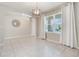 Inviting dining room with bright neutral paint and large windows at 6808 Cranes Roost Rd, Harmony, FL 34773