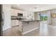 Modern kitchen features sleek white cabinetry, stainless steel appliances, and a functional center island at 6808 Cranes Roost Rd, Harmony, FL 34773