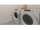 Laundry room featuring a modern washer and dryer set at 6808 Cranes Roost Rd, Harmony, FL 34773