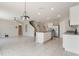 Spacious living room features tile floors, recessed lighting, stainless appliances, and kitchen island at 6808 Cranes Roost Rd, Harmony, FL 34773