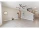 Spacious living room boasts neutral tones, tile floors, and an airy feel at 6808 Cranes Roost Rd, Harmony, FL 34773