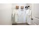 Walk-in closet with wire shelving and rods, providing ample space for hanging clothes and storing items at 7807 Waterscape Dr, Groveland, FL 34736