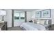 Comfortable bedroom with a window view, soft decor, neutral color palette, and cozy ambiance at 7811 Waterscape Dr, Groveland, FL 34736