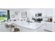 Bright kitchen with white cabinets, stainless steel appliances, and an island at 7811 Waterscape Dr, Groveland, FL 34736