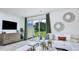Cozy living room with a sliding glass door that leads to a patio at 7811 Waterscape Dr, Groveland, FL 34736