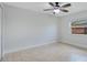 Bedroom with tile floors, a ceiling fan, window and closet at 811 Osceola Trl, Casselberry, FL 32707