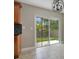 Dining area with sliding glass doors to the outside and wood-toned cabinets at 811 Osceola Trl, Casselberry, FL 32707