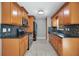 Updated kitchen with sleek black appliances, tile backsplash, and well-maintained wooden cabinets at 811 Osceola Trl, Casselberry, FL 32707