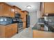 Modern kitchen with stainless appliances, granite countertops, and tile backsplash, ready for gourmet cooking at 811 Osceola Trl, Casselberry, FL 32707