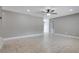 Open-concept room with light tile flooring, neutral walls, and plenty of natural light at 811 Osceola Trl, Casselberry, FL 32707