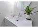 Contemporary bathroom vanity with a stylish sink, mirror, and a decorative plant, creating a fresh look at 8111 Lianna Dr, Orlando, FL 32822