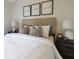 Relaxing bedroom with white bedding, decorative pillows, bedside lamps, and a calming atmosphere at 8111 Lianna Dr, Orlando, FL 32822